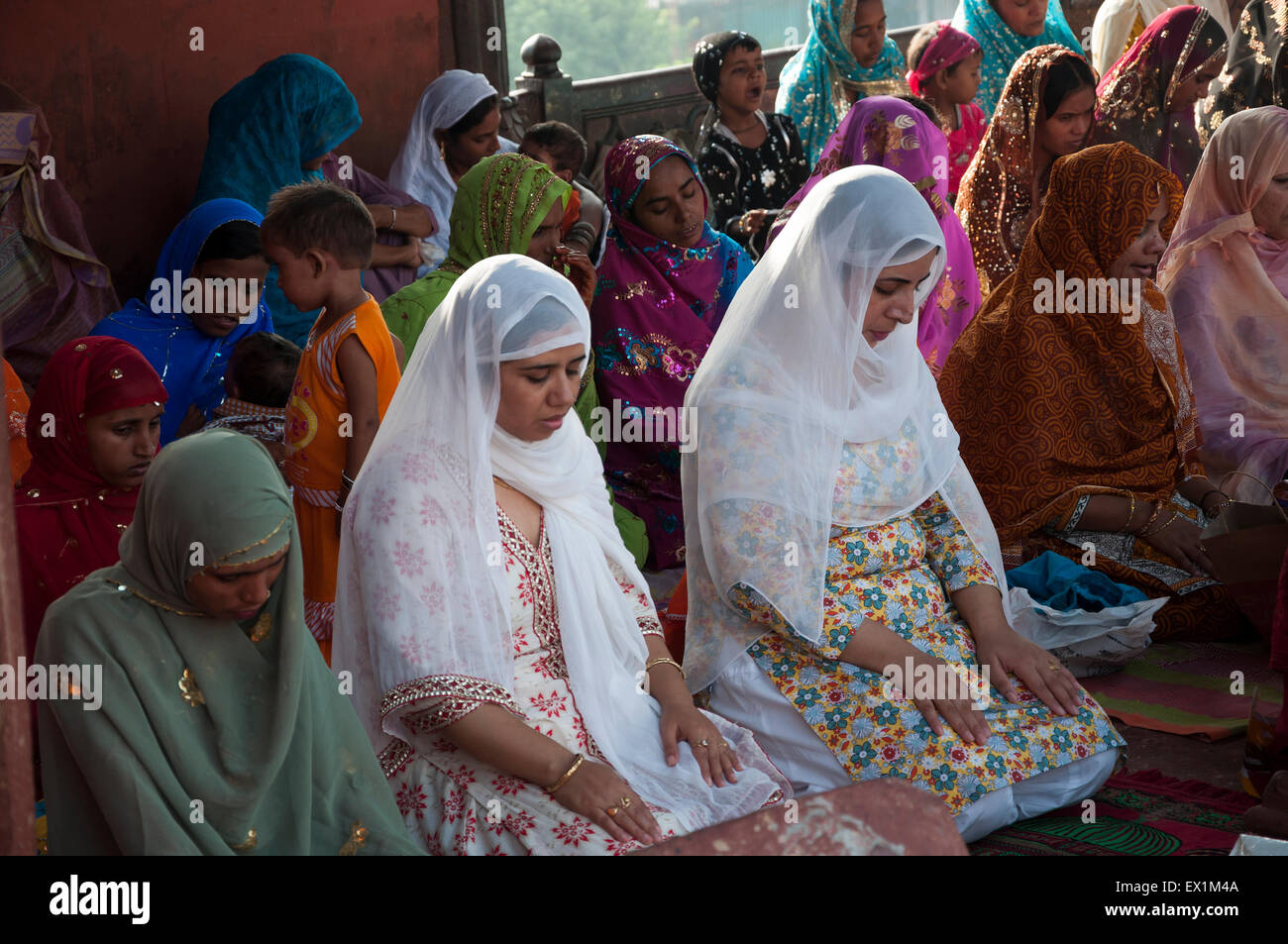 Women praying during the festival of Eid-ul-fitr at the Jama Masjid mosque in old Delhi, India. Stock Photo