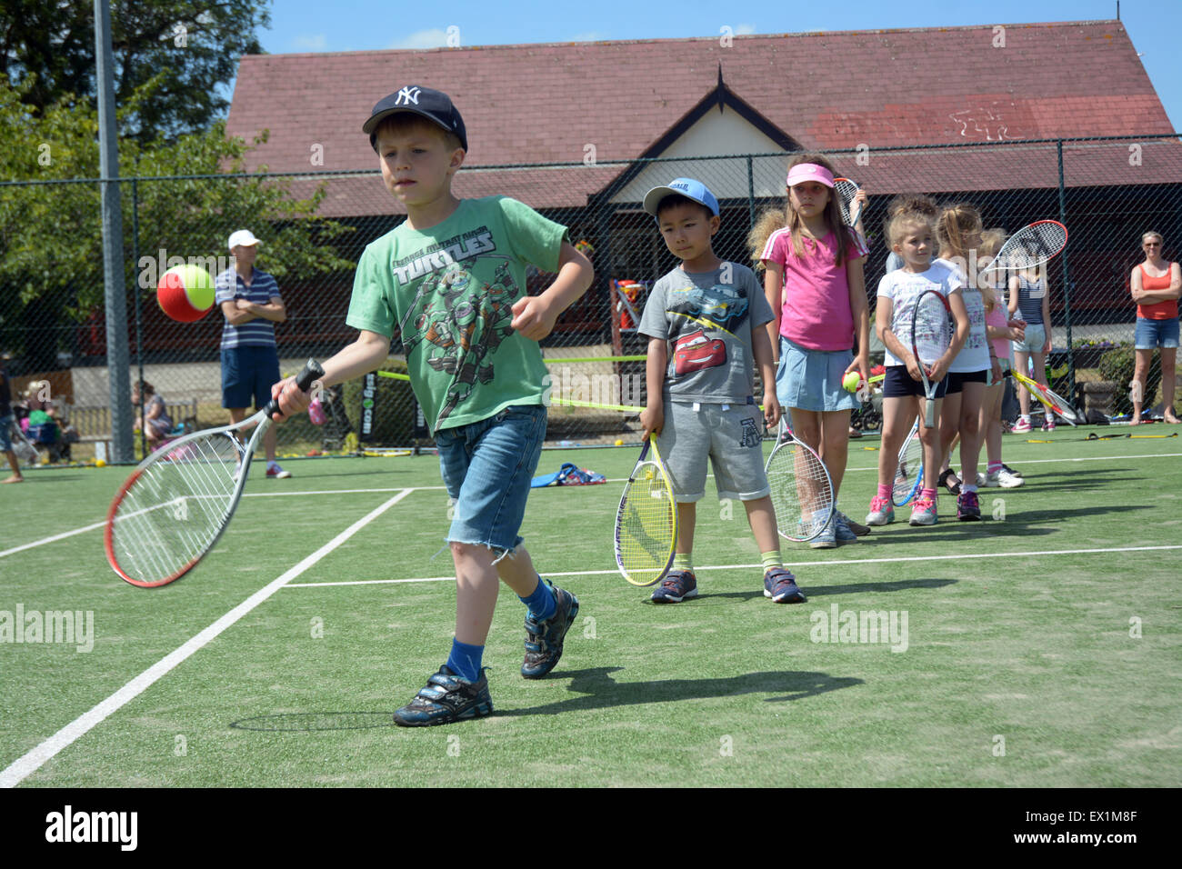 Kids line up to hit with British tennis stars in Wimbledon Park halfway