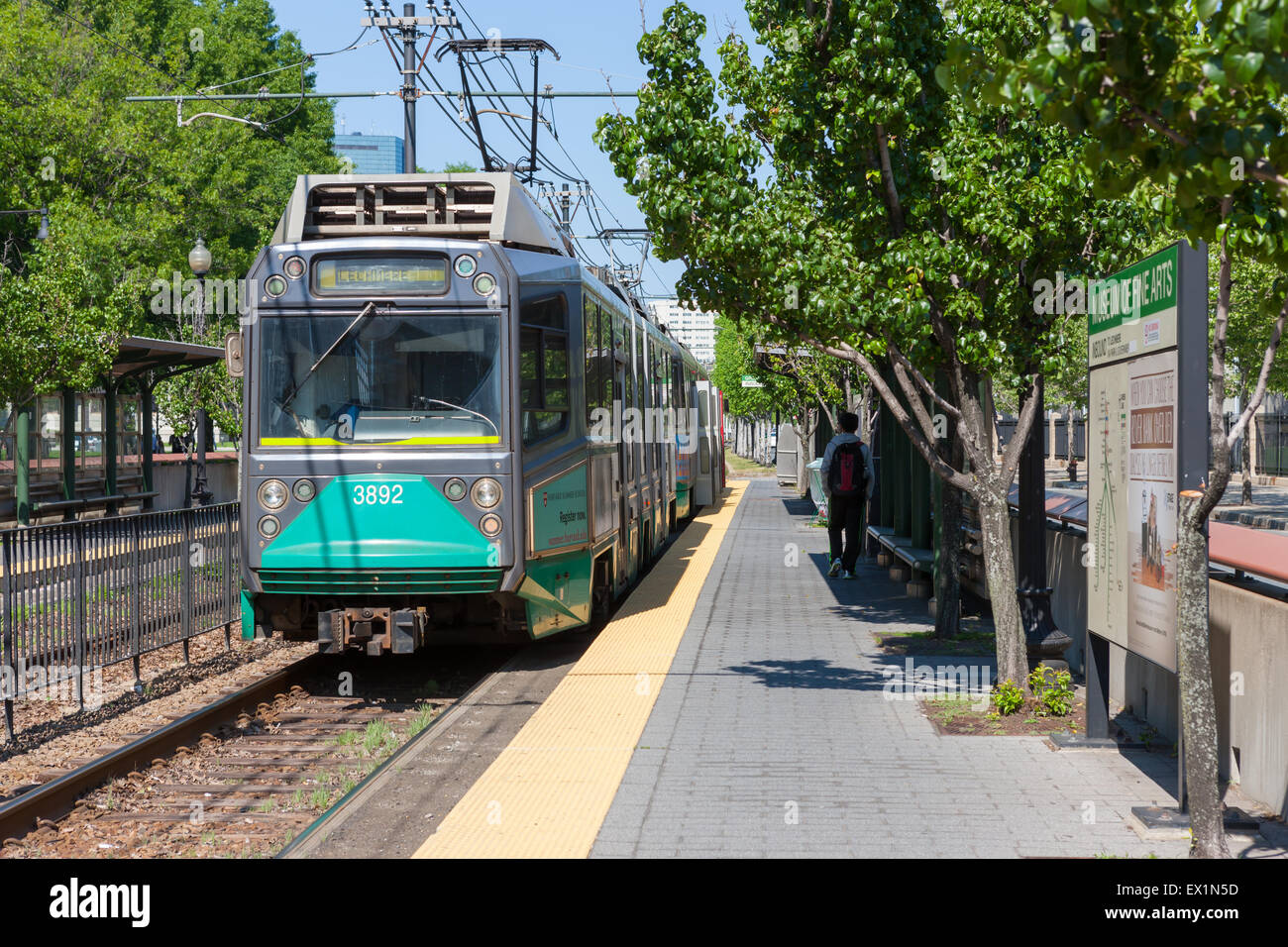 An outbound train on the MBTA Huntington Avenue Line prepares to depart the Museum of Fine Arts (MFA) Station in Boston, Massachusetts. Stock Photo