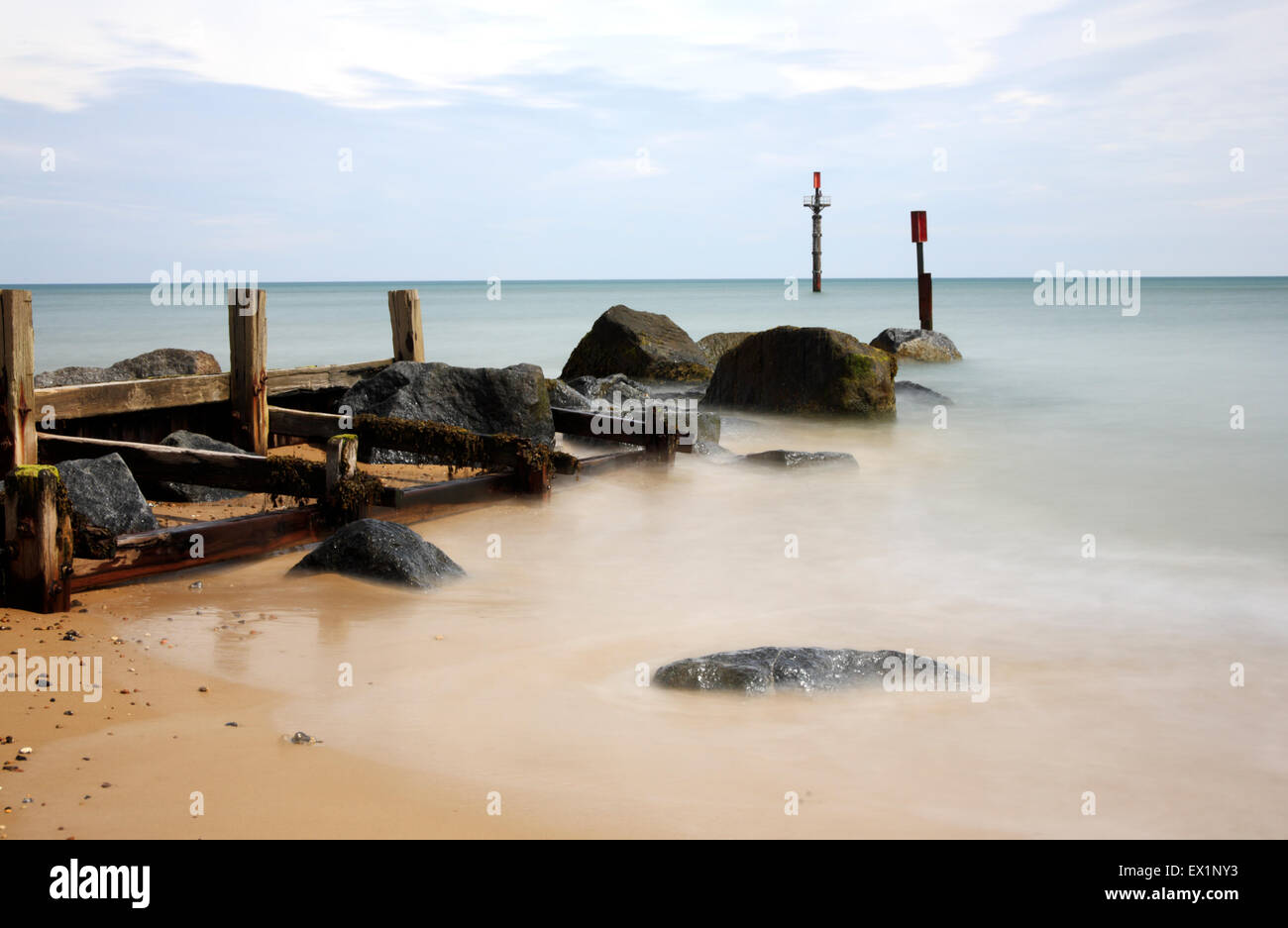 A view of a groyne and the sea utilising a 10 stop light loss filter to smooth the motion of the sea. Stock Photo