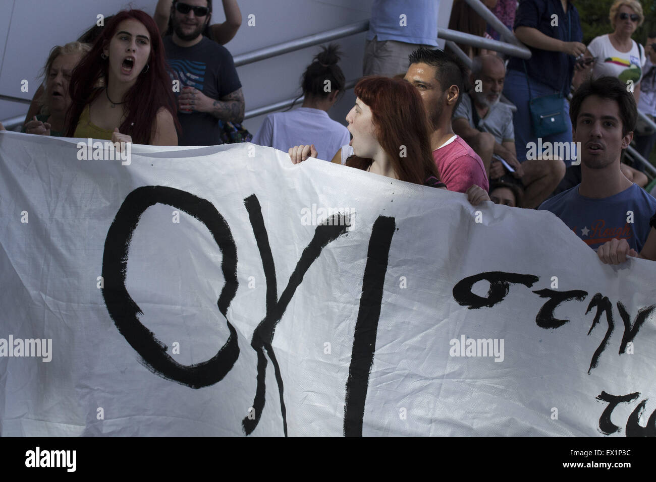 Athens, Greece. 4th July, 2015. Protesters shout slogans against Greek media accusing them of propaganda in favor of the Yes vote on the upcoming referendum. Greece is ranked No 91 out of 180 countries in the World Press Freedom Index, while all mainstream TV channels are owned by Greek tycoons. Credit:  Nikolas Georgiou/ZUMA Wire/ZUMAPRESS.com/Alamy Live News Stock Photo