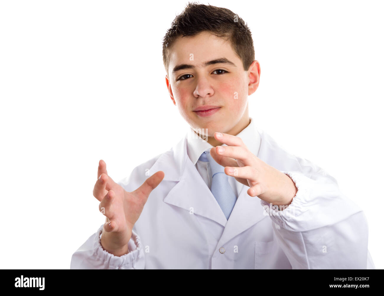 Boy dressed as a doctor in light blue tie and white coat helps to feel medicine more friendly: he making the gesture of moving hands as to reach viewers, catch something and drive to him. This means drive attention and give importance at the same time to Stock Photo