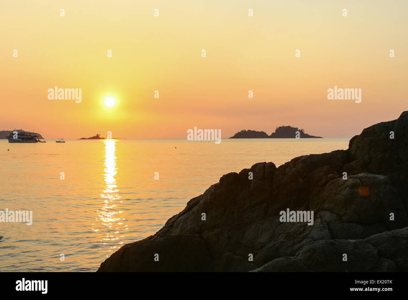 The view of beautiful sunset above the sea with ship on the horizon ...