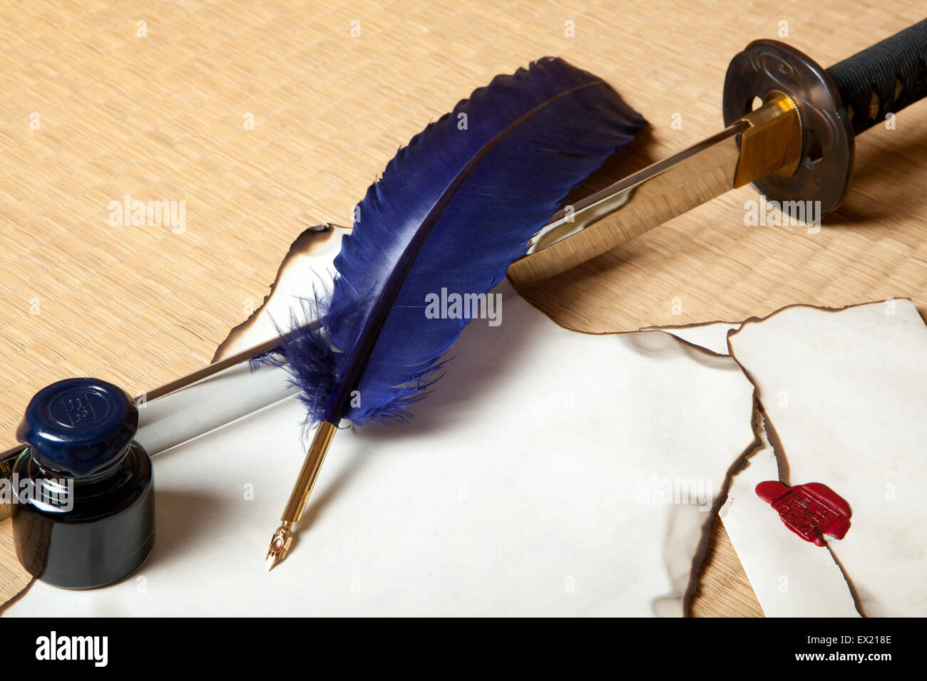 Feather and letter with a japanese sword Stock Photo