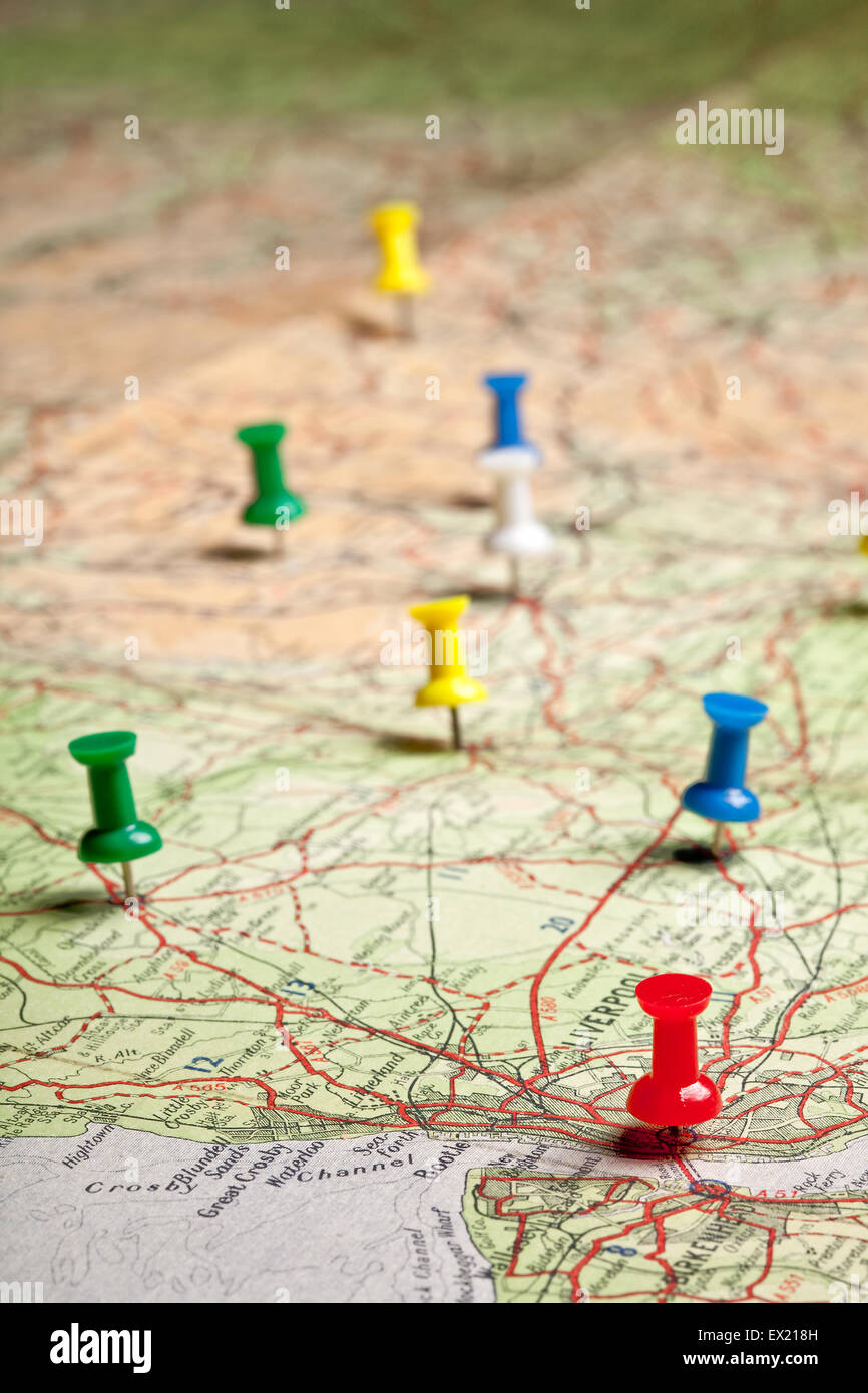 Colored pushpins on a road map of a tourist Stock Photo