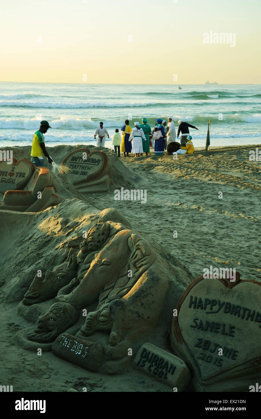 Durban, KwaZuluNatal, South Africa, sand artist working close to