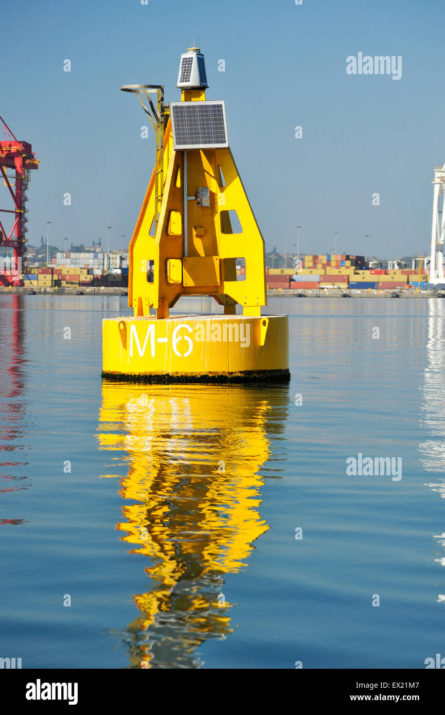 Yellow channel marker buoy near container terminal Durban harbour South