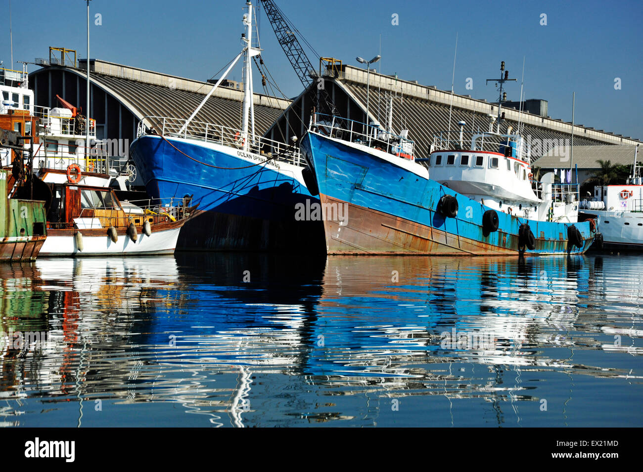 Rustic harbour scene reflection of boats on water Durban South ...