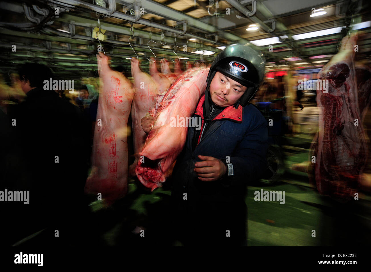 Labourers work at pork wholesale market in Hefei, Anhui province January 13, 2010. VCP Stock Photo
