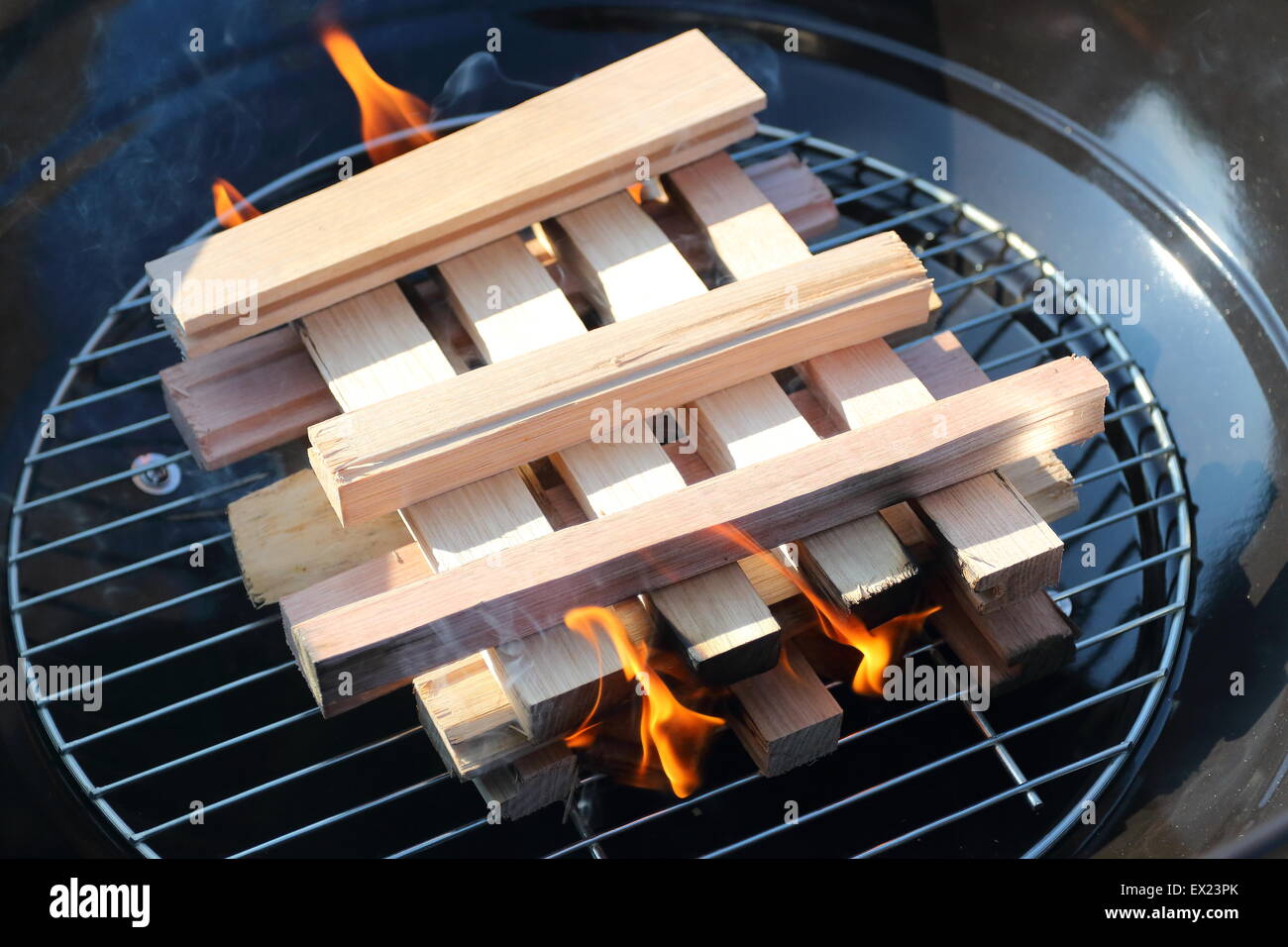 Burning kindling charcoals in portable bbq barbecue Stock Photo Alamy