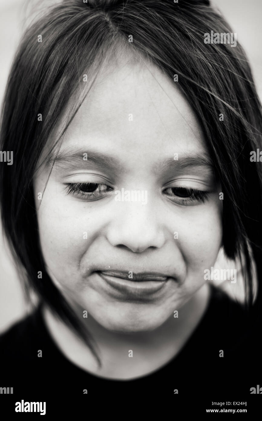 Young child making faces in close-up Stock Photo