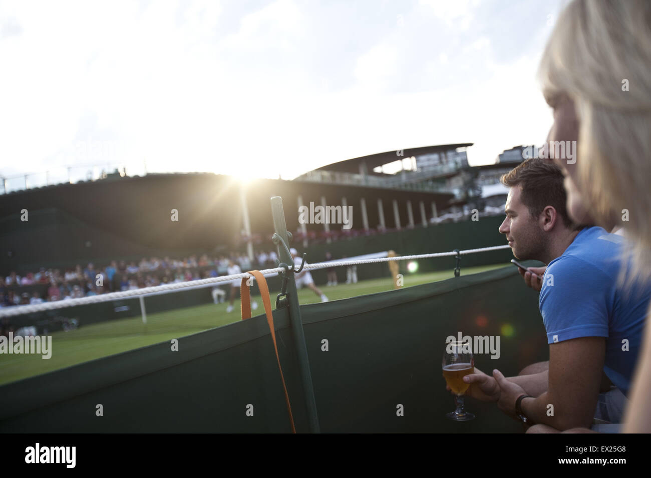 London, UK. 3rd July, 2015. Spectators at Wimbledon.The Championships, Wimbledon or simply Wimbledon, is the oldest tennis tournament in the world, and is widely considered the most prestigious. It has been held at the All England Club in Wimbledon, London since 1877, London, UK. © Veronika Lukasova/ZUMA Wire/Alamy Live News Stock Photo