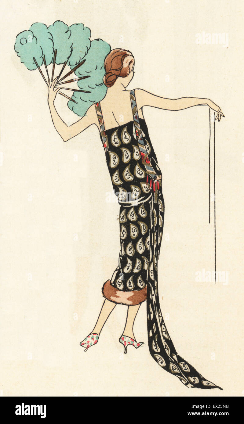 Evening dress in silver and gold lame on black trimmed with coral beads. Lithograph with pochoir (stencil) handcolour from the luxury fashion magazine Art, Gout, Beaute, Paris, 1925. Stock Photo
