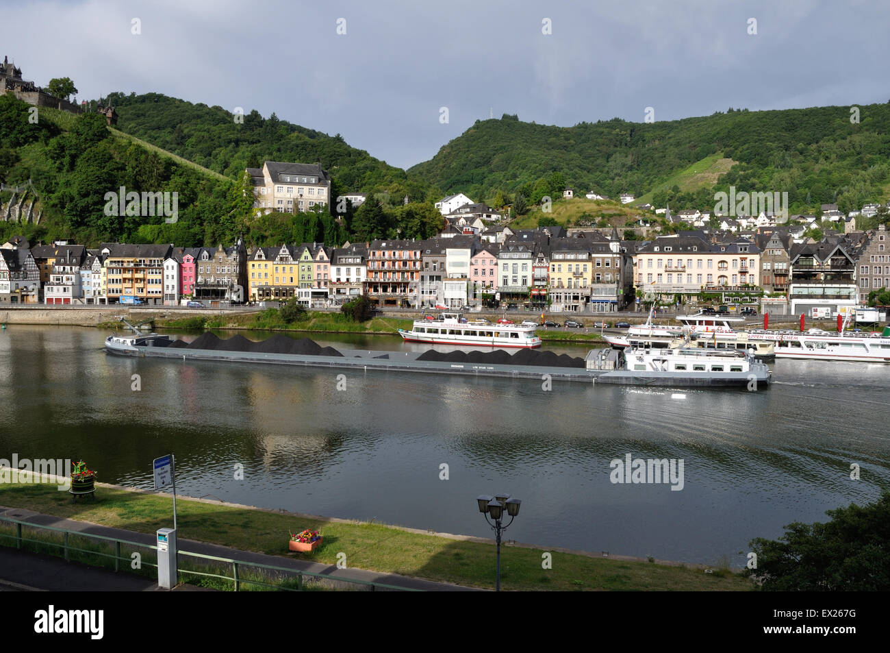 Cargo barge Graciosa, registered in Antwerp, Belgium, travels up the River Moselle at Cochem, Germany, laden with coal. Stock Photo