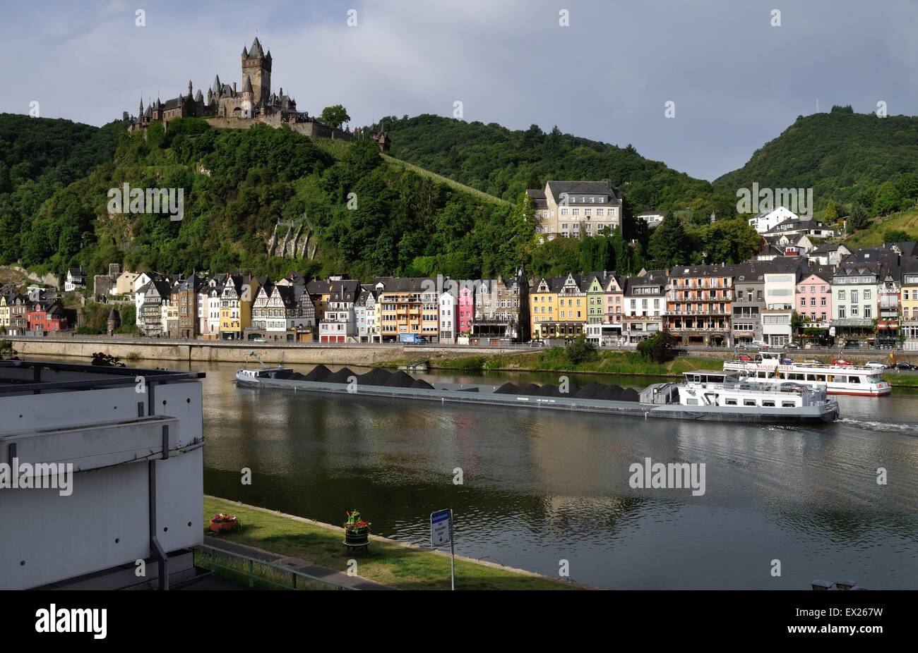 Cargo barge Graciosa, registered in Antwerp, Belgium, travels up the River Moselle at Cochem, Germany, laden with coal. Stock Photo