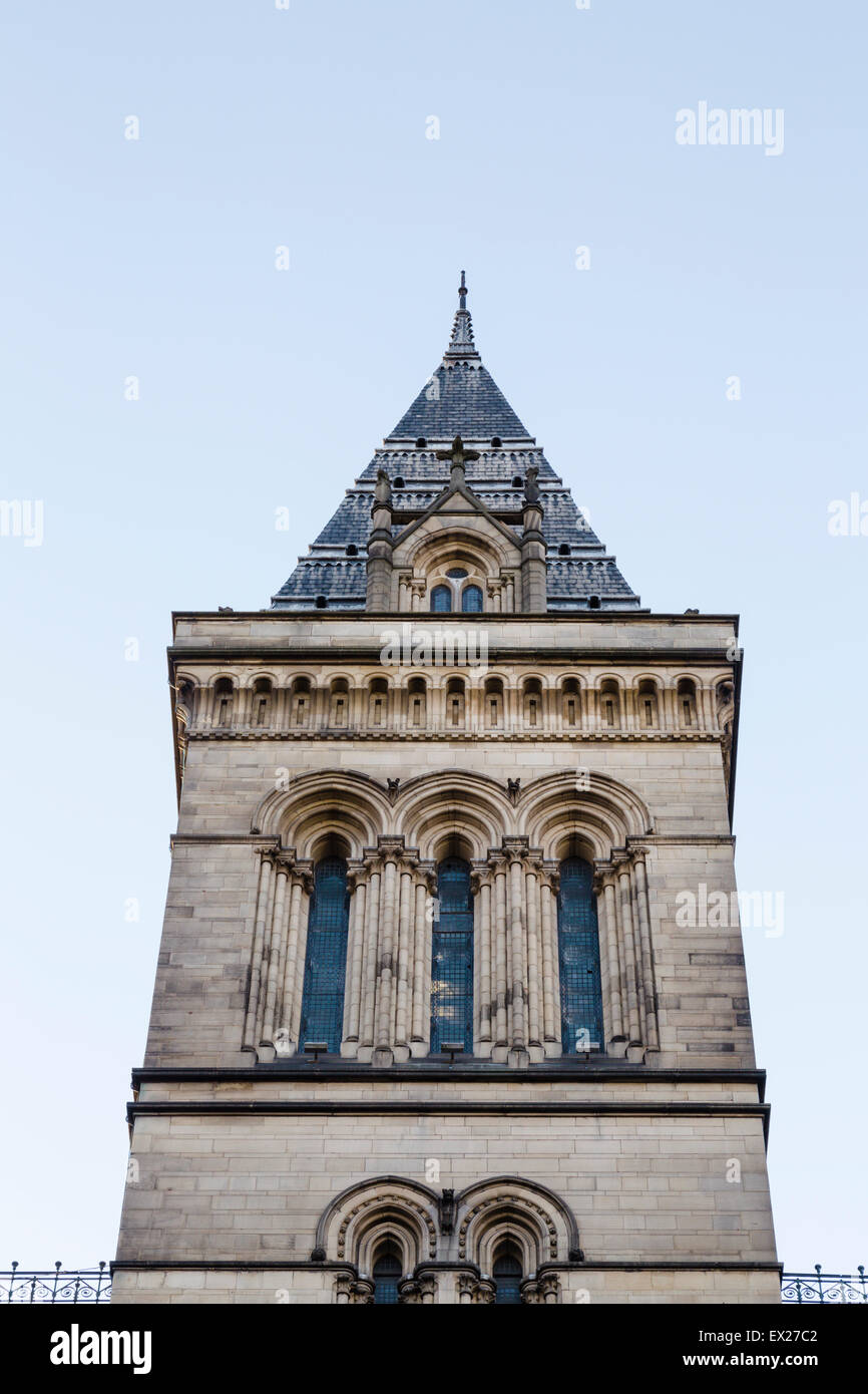 A tower of Manchester Town Hall, designed by Alfred Waterhouse, facing onto St Peter's Square, with blue evening sky. Stock Photo