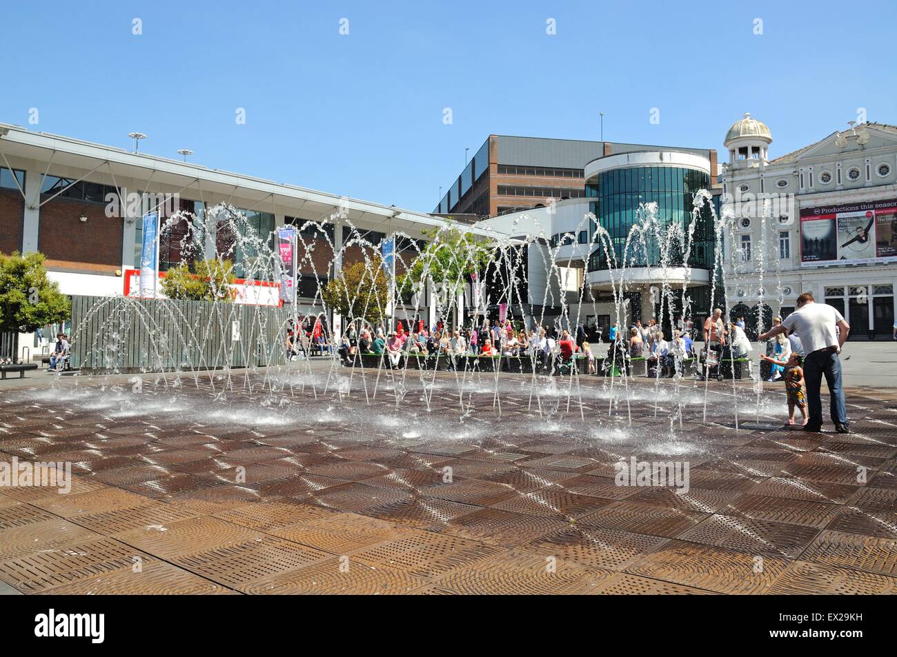 The Playhouse Theatre in Williamson Square with fountains in the foreground and people enjoying the Summer sunshine, Liverpool, Stock Photo