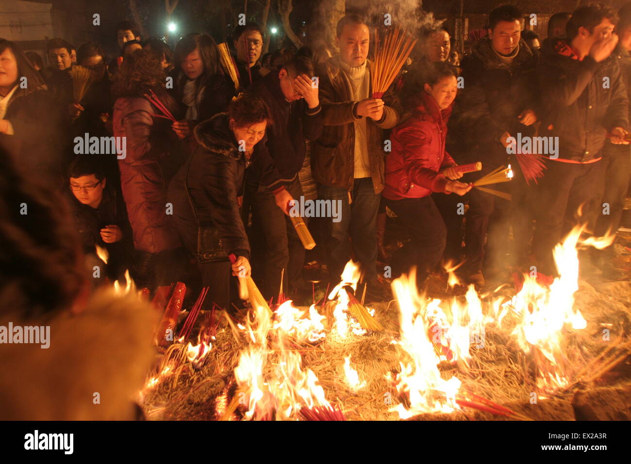 Worshippers burn offerings on the fifth day of the Chinese Lunar New ...