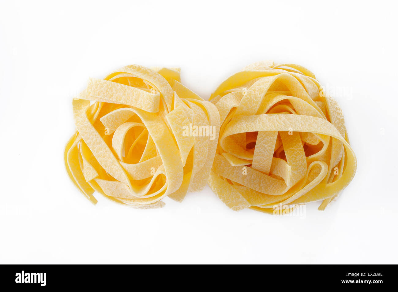 egg fettuccine pasta on white background Stock Photo Alamy