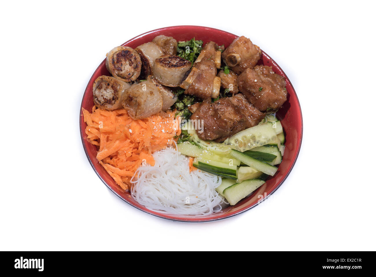 Bowl of beef Bo bun with salad, pork ribs, fresh herbs Stock Photo