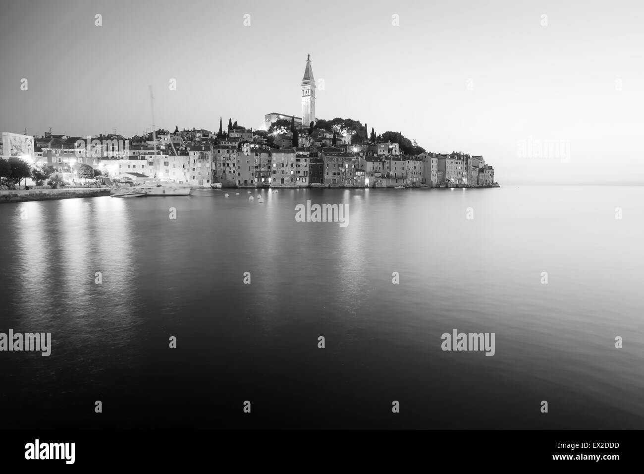 A view of the old city core with the Saint Euphemia church and bell tower at sunset in Rovinj, Croatia. Stock Photo