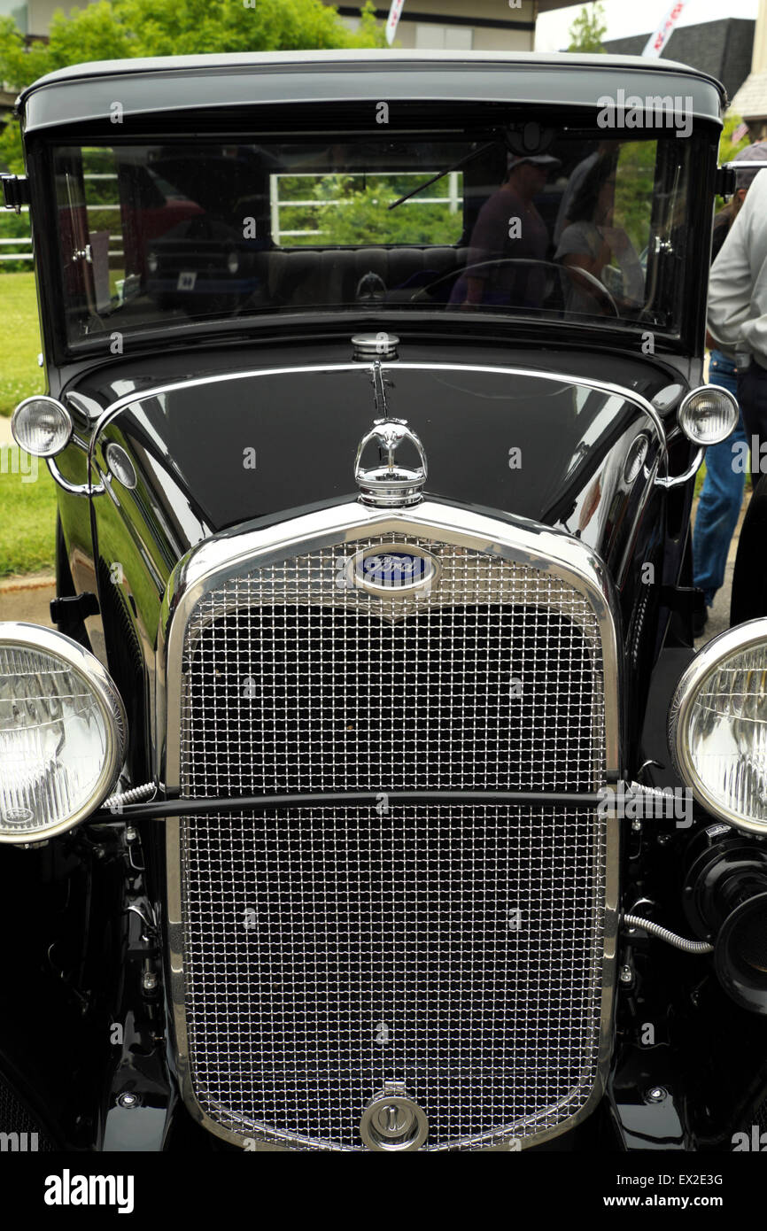 Front end and windshield of a restored 1930 Ford Model A sedan. Stock Photo