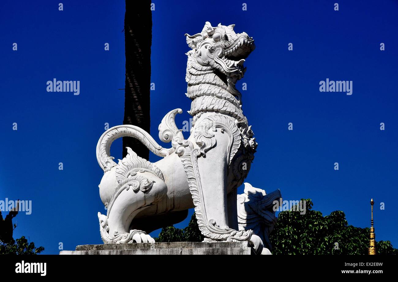 Chiang Mai, Thailand:  Carved stone statue of a dragon stands in a courtyard at Wat Chang Taem Stock Photo