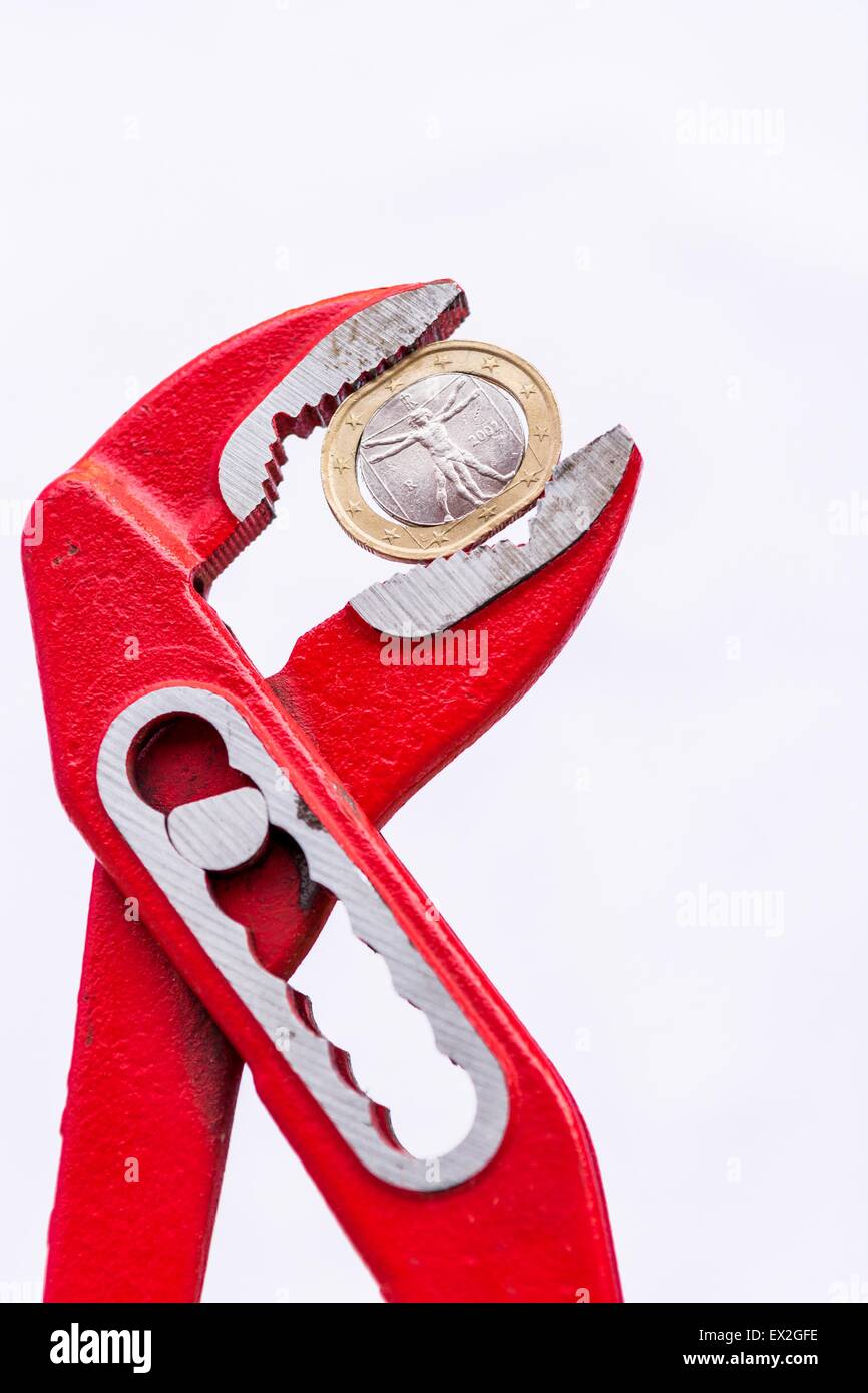 Italian Euro coin squezzed with pliers. Stock Photo