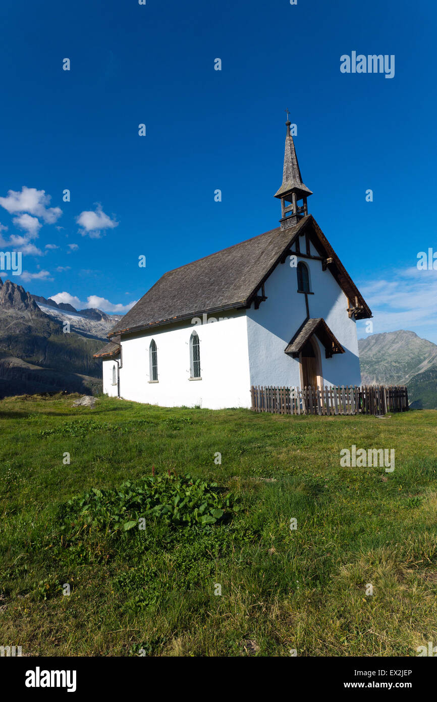 A small white church in the alps of the Valais, Switzerland Stock Photo ...