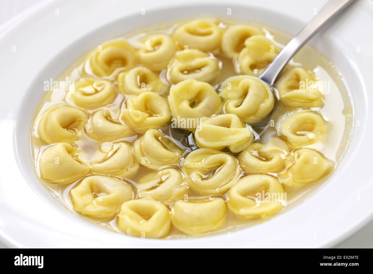 tortellini in brodo, ring shaped pasta in broth, italian emilia romagna soup cuisine Stock Photo