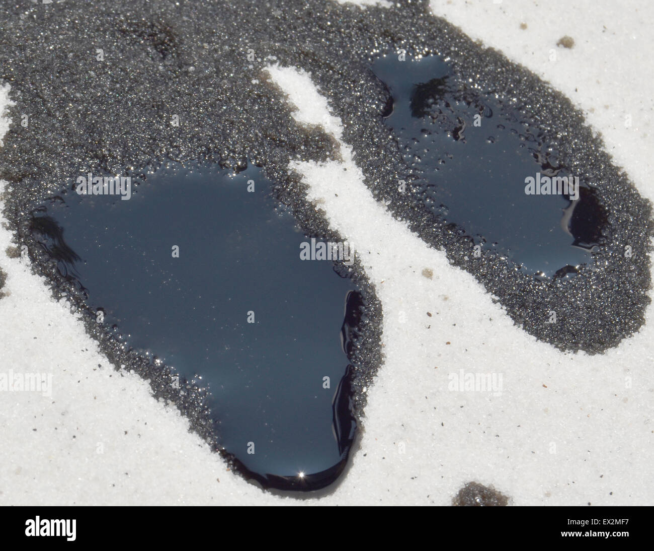 oil spill on white sand Stock Photo Alamy