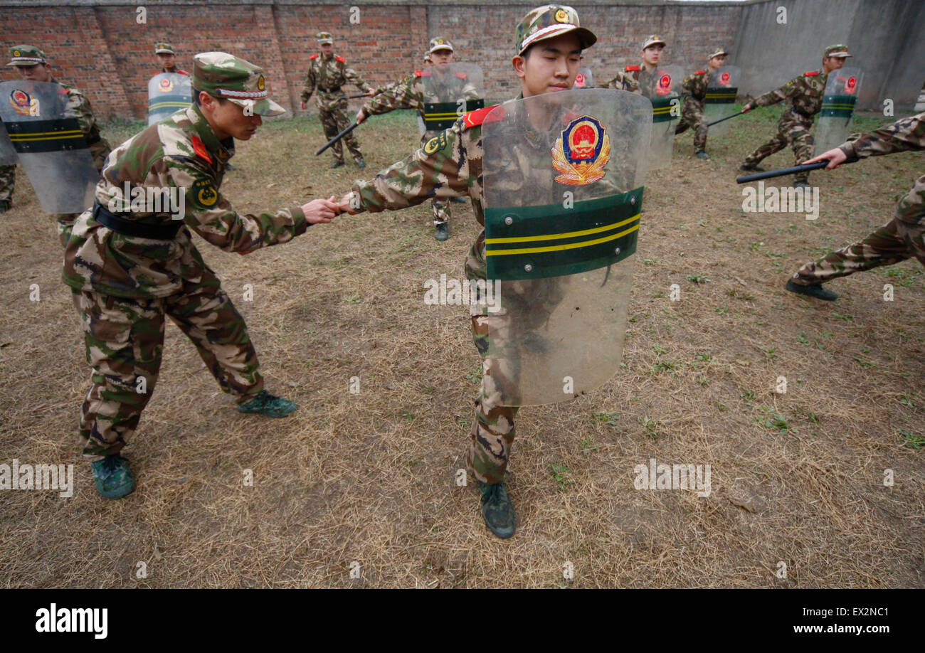 Recruits of Paramilitary policemen attend a training session at a military base in Suining, Sichuan province, March 4, 2010.  VC Stock Photo