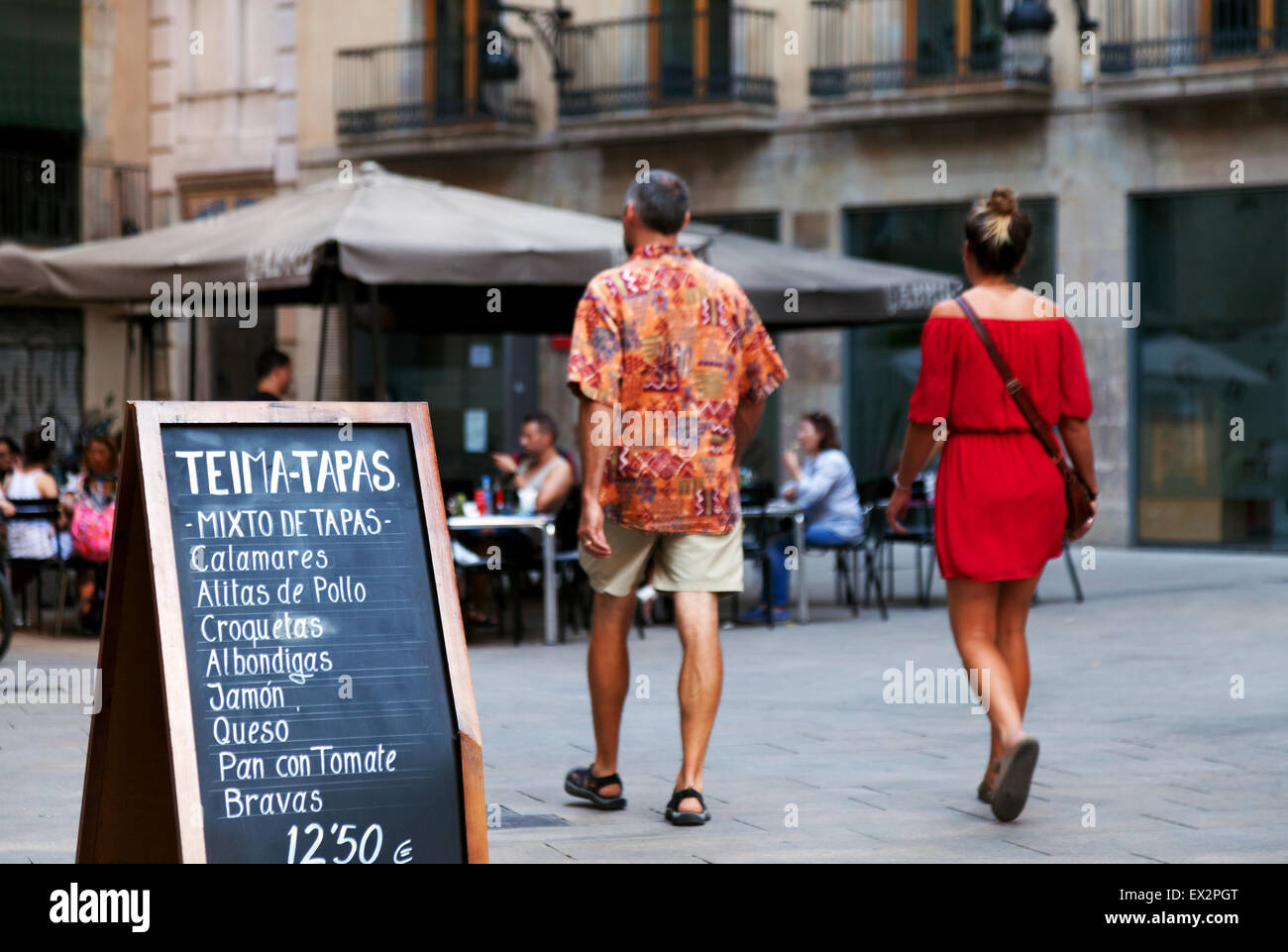 Tapas bar spain; A couple going to a tapas bar for an evening meal, The Gothic Quarter ( Barri Gotic ), Barcelona, Spain Europe Stock Photo