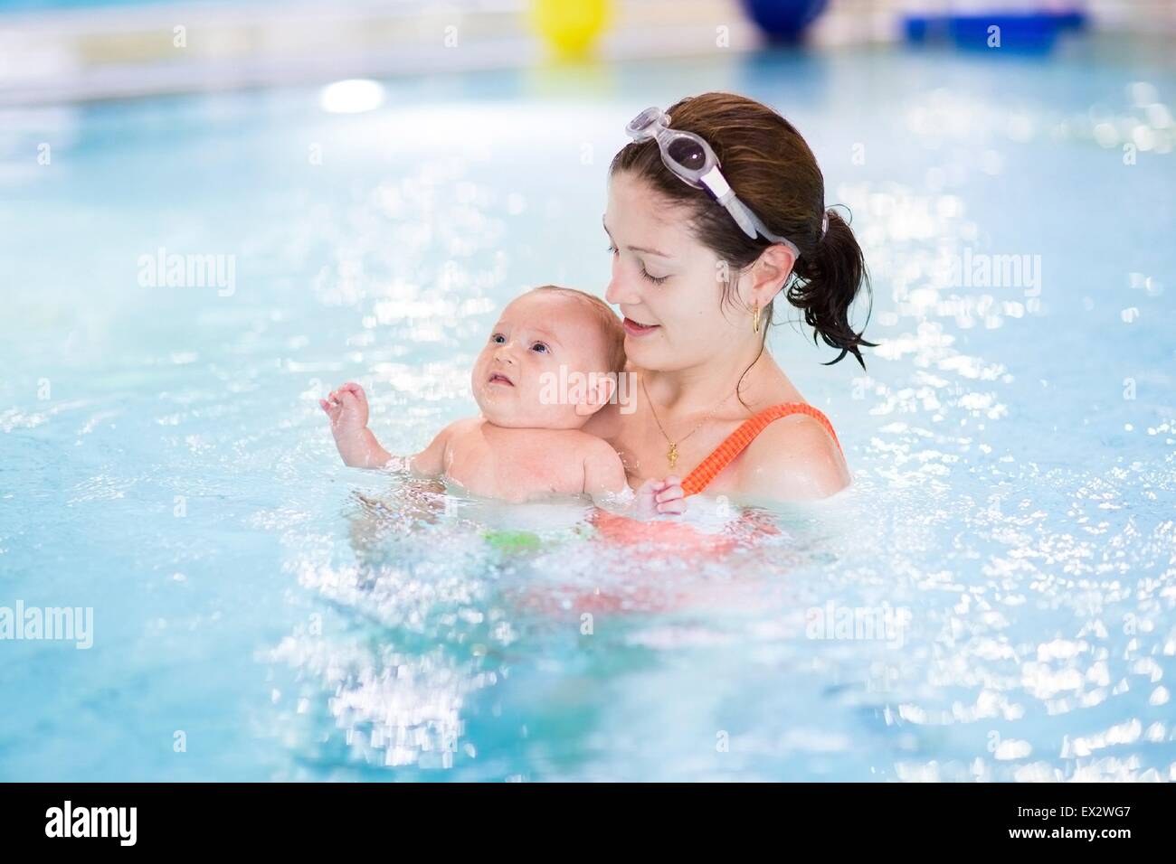 Little baby boy first time in a swimming pool Stock Photo Alamy