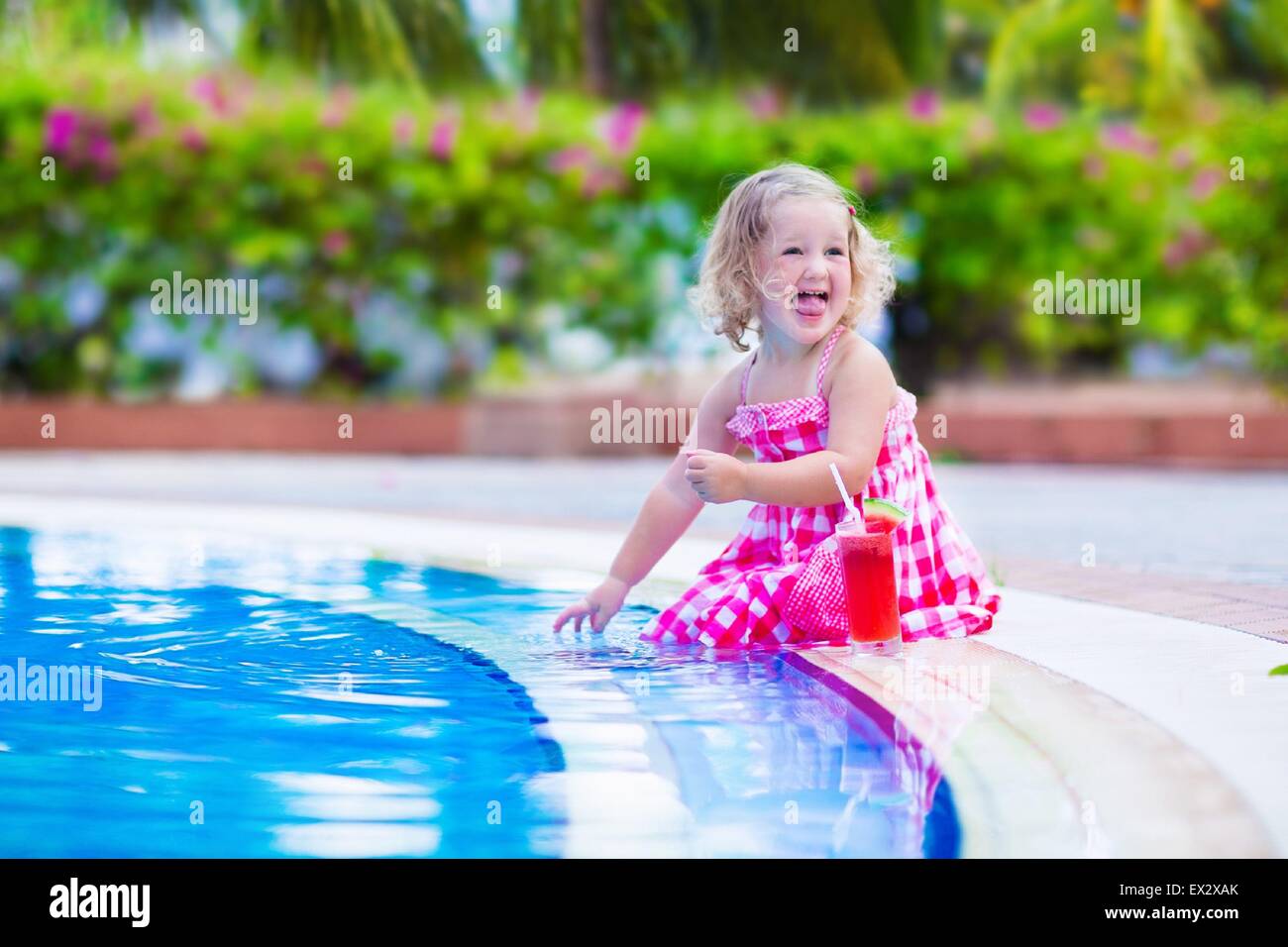 Beautiful Little Girl Cute Toddler With Curly Hair Wearing A Red