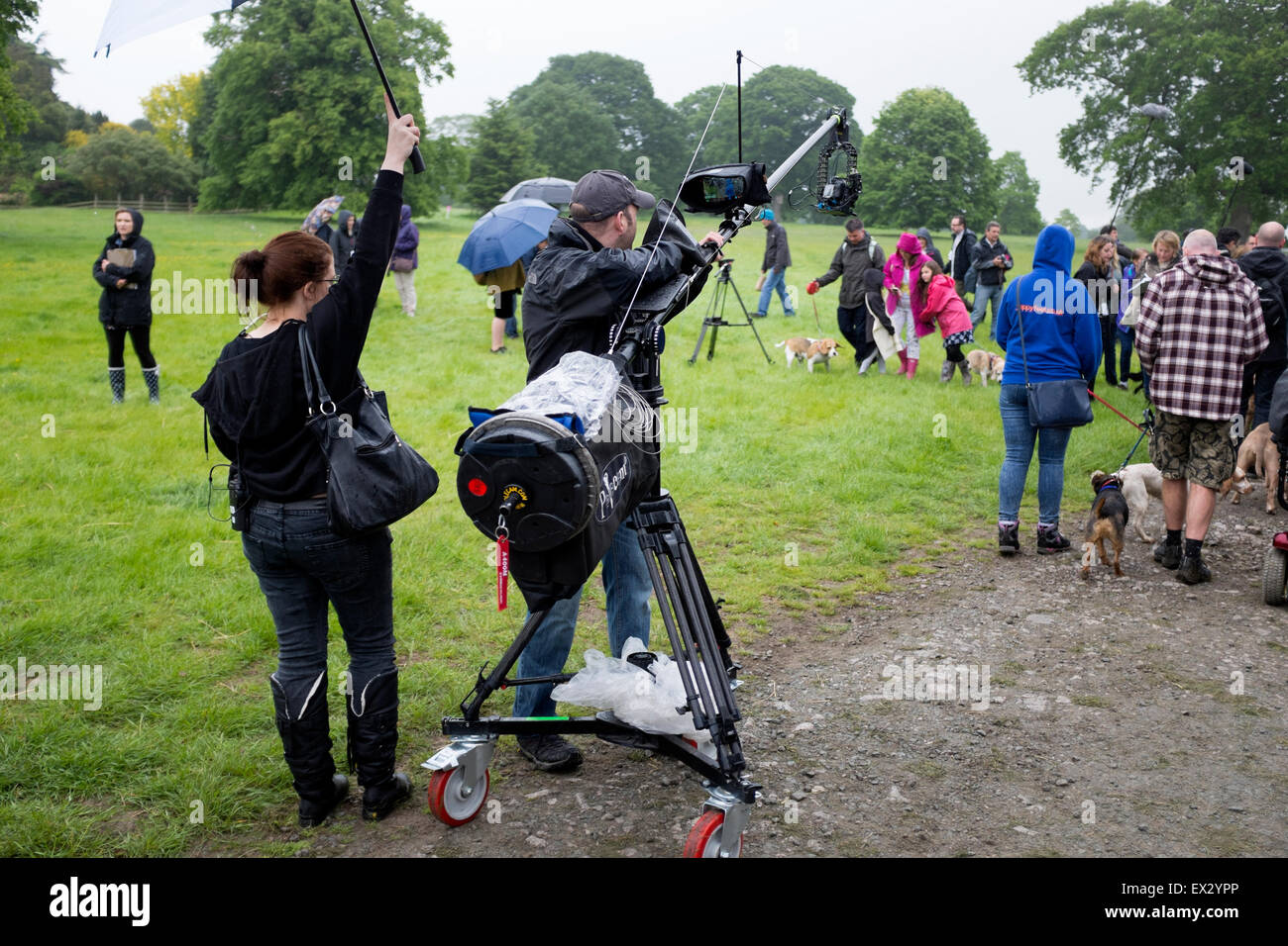 Outside Broadcast Television Crew Filming in Rain Stock Photo