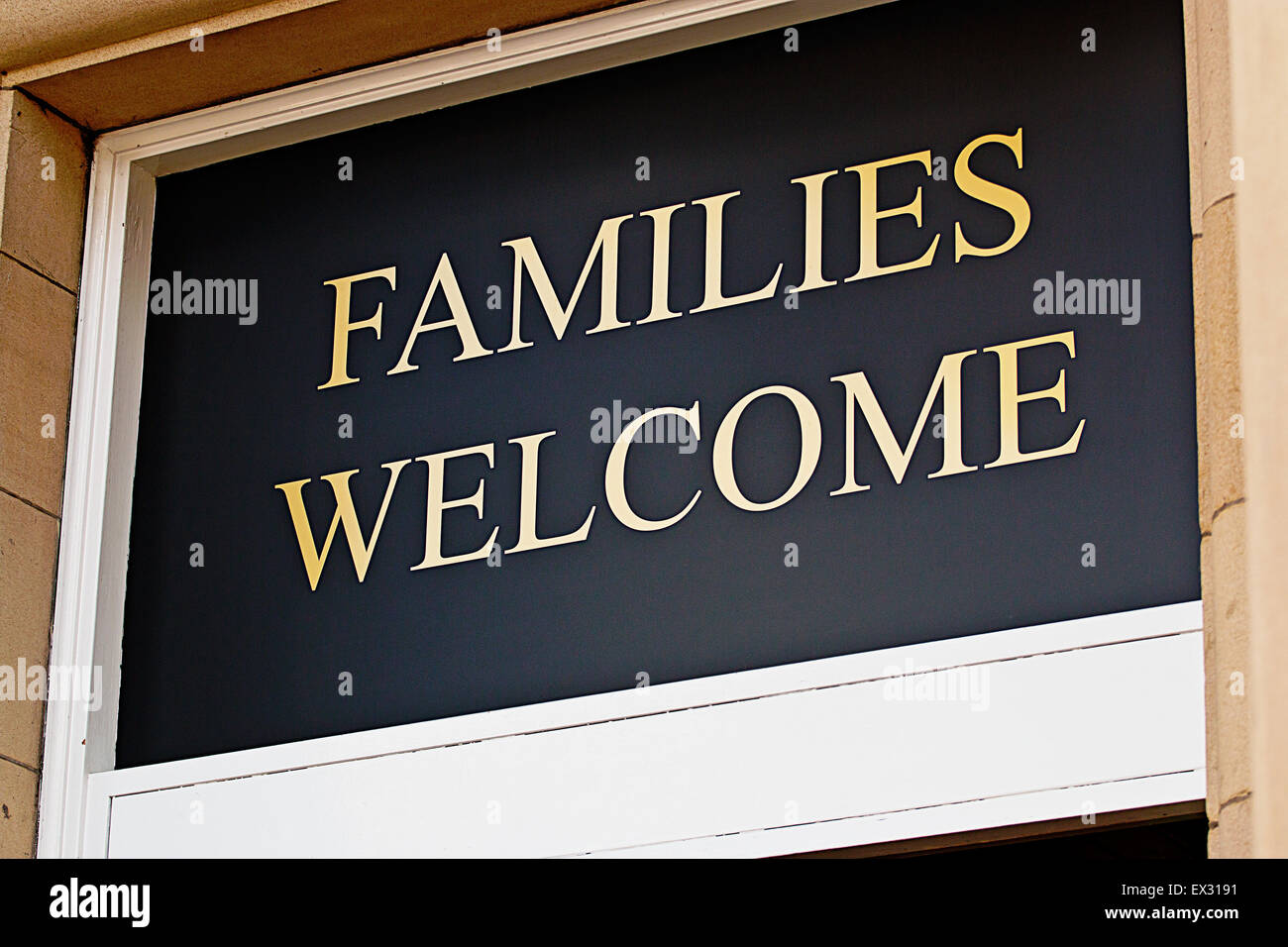 Families welcome sign outside restaurant inviting children to eat bar meals in selected licensed premises Stock Photo