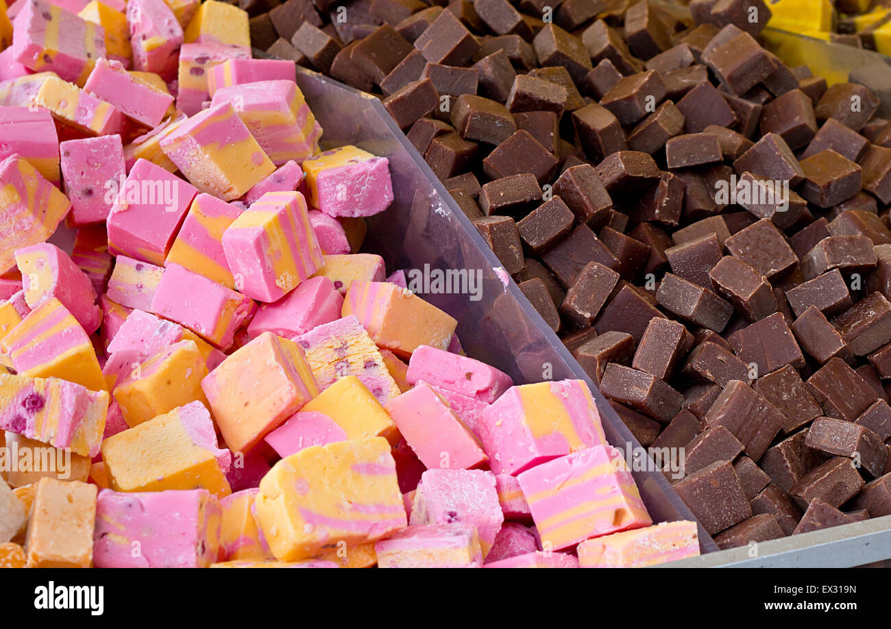 Selection of fudges for sale in a pick and mix counter where people select their own favourite penny mixtures from the wide rang Stock Photo