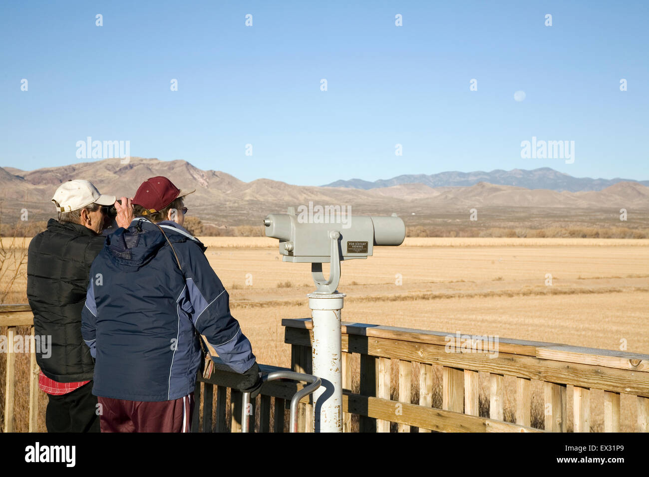 Several of the observation decks at Bosque del Apache National Wildlife Refuge are fitted with spotting scopes. Stock Photo