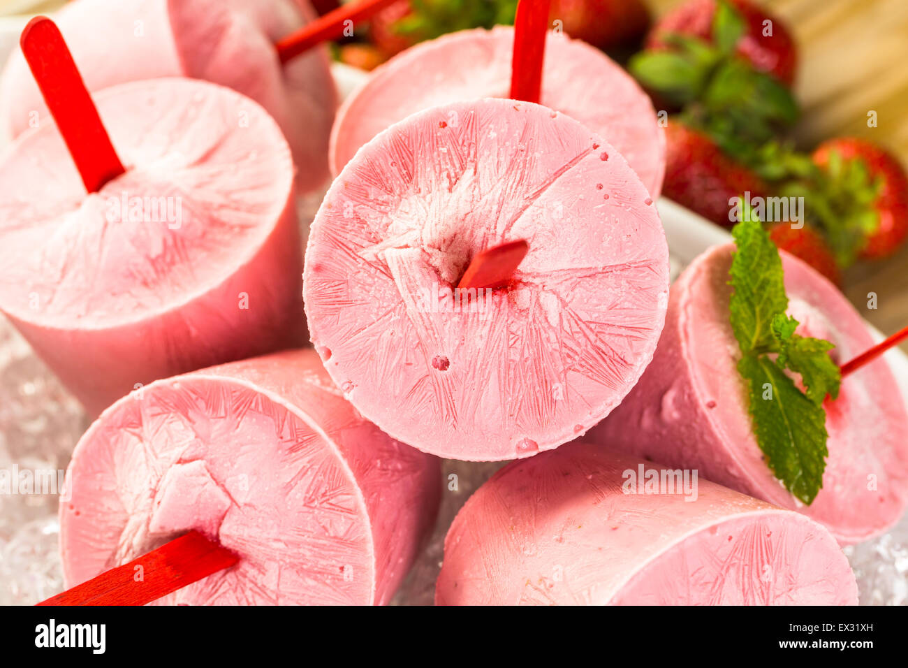 Homemade strawberry popsicles made in plastic cups Stock Photo Alamy
