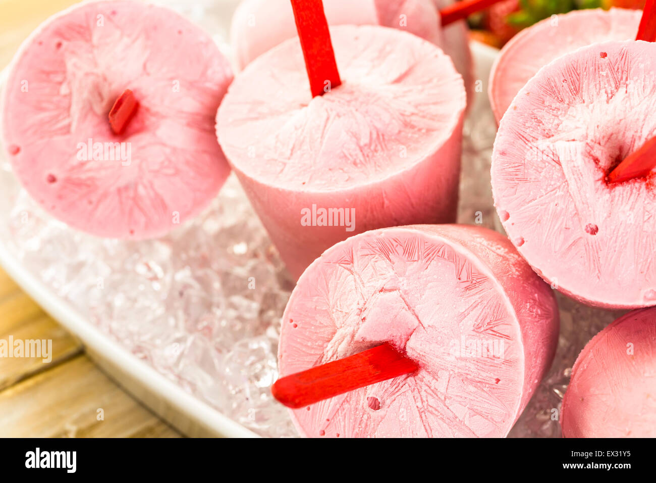 Homemade strawberry popsicles made in plastic cups Stock Photo Alamy