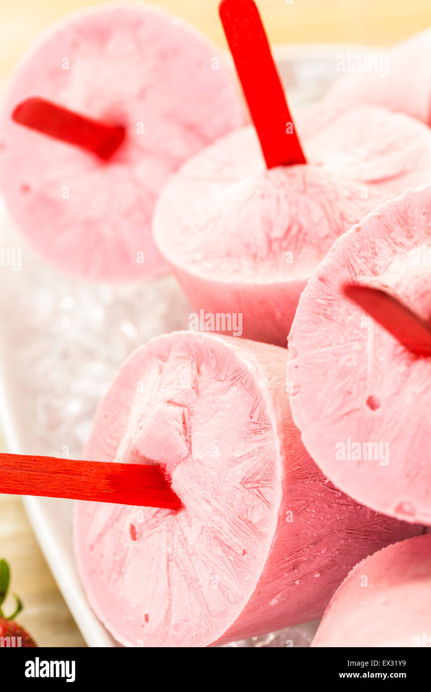 Homemade strawberry popsicles made in plastic cups Stock Photo Alamy