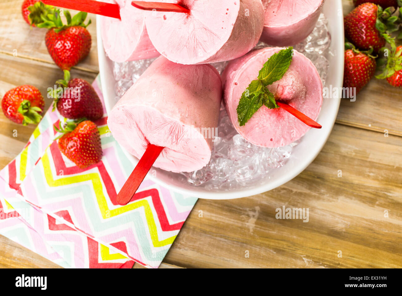 Homemade strawberry popsicles made in plastic cups Stock Photo Alamy