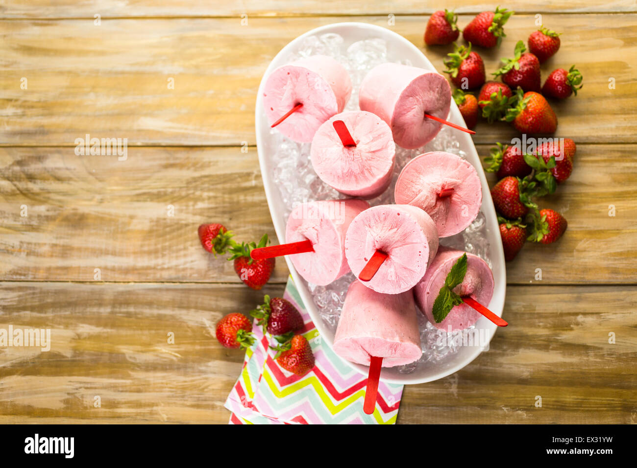 Homemade strawberry popsicles made in plastic cups Stock Photo Alamy