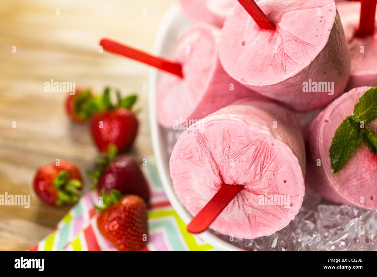 Homemade strawberry popsicles made in plastic cups Stock Photo Alamy