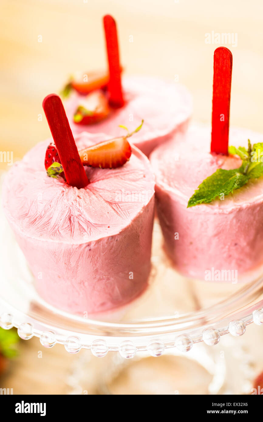 Homemade strawberry popsicles made in plastic cups Stock Photo Alamy