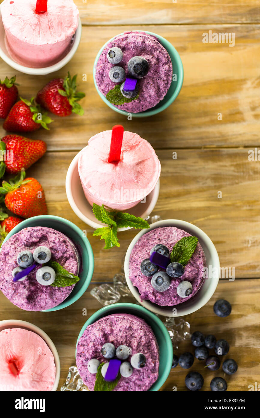 Homemade blueberry and strawberry popsicles made in plastic cups Stock Photo Alamy