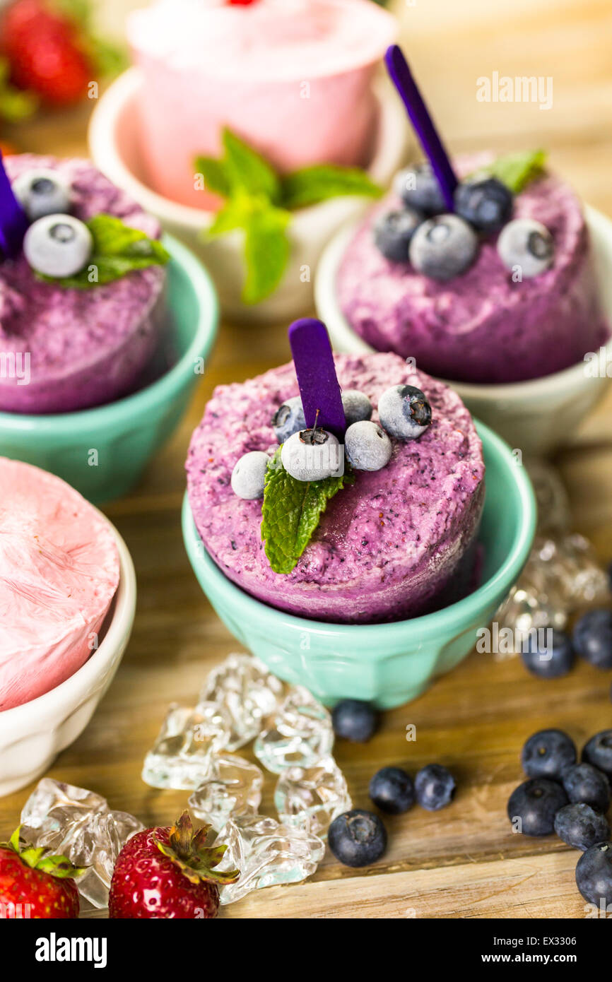 Homemade blueberry and strawberry popsicles made in plastic cups Stock Photo Alamy