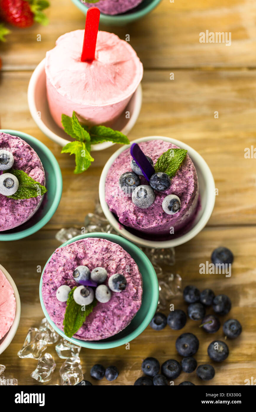 Homemade blueberry and strawberry popsicles made in plastic cups Stock Photo Alamy