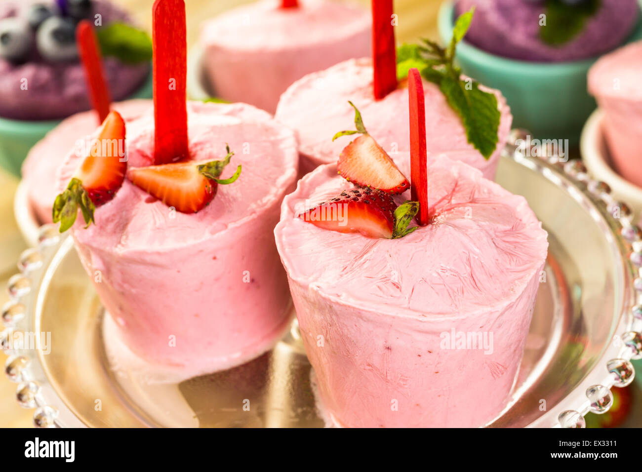Homemade blueberry and strawberry popsicles made in plastic cups Stock Photo Alamy
